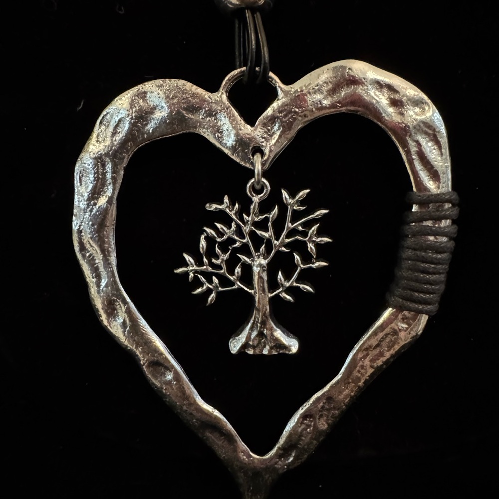 Silver Heart Pendant with Tree of life Design not Sterling. But still beautiful.
